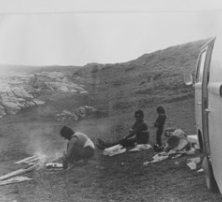 “Here’s a picture of my mom cooking barbecue at Seal Point, South Africa, with Eddie, me, my sister and our combi, 1972.”